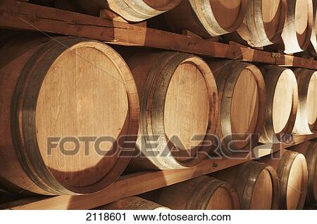 Stock Image - Wine Barrels Stacked On Shelves; Niagara Ontario Canada. Fotosearch