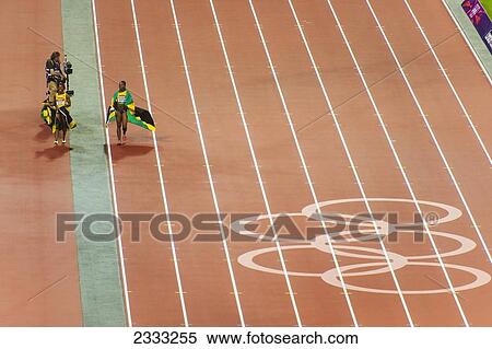 Stock Photography - Winners Of Olympic Track Event Celebrating, Elevated View; London, England, Uk. Fotosearch
