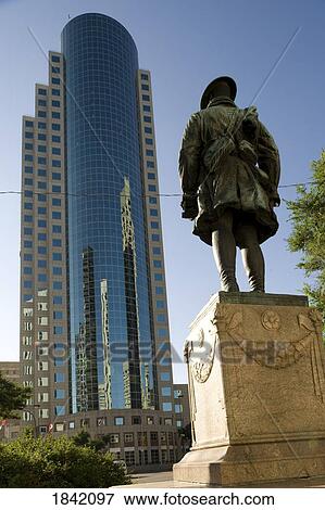 Stock Photo - Winnipeg, Canada; War Memorial Shown Against A Modern Skyscraper. Fotosearch