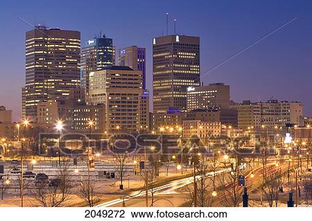 Stock Image - Winnipeg Skyline At Night, Shot From The Forks Towards Portage And Main St., Winnipeg, Manitoba. Fotosearch