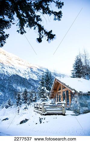 Winter alpine scenery with mountains, snow and a pine forest with Brekke rental cabins; Ortnevik, Sognefjord, Norway View Large Photo Image Stock Photo - Winter alpine scenery with mountains, snow and a pine forest with Brekke rental cabins; Ortnevik, Sognefjord, Norway. Fotosearch