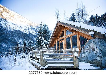Winter alpine scenery with mountains, snow and a pine forest with Brekke rental cabins; Ortnevik, Sognefjord, Norway View Large Photo Image Stock Photo - Winter alpine scenery with mountains, snow and a pine forest with Brekke rental cabins; Ortnevik, Sognefjord, Norway. Fotosearch