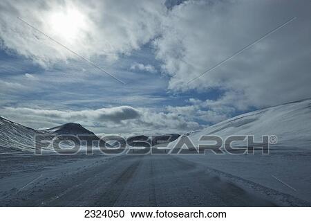 Stock Image - Winter driving along the Ring Road near Myvatn Lake, northern Iceland; Iceland. Fotosearch