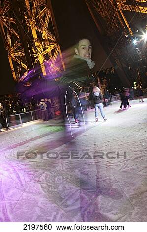 Winter In Paris, France. Ice Skating On The First Floor Of The Tour Eiffel. View Large Photo Image Stock Image - Winter In Paris, France. Ice Skating On The First Floor Of The Tour Eiffel.. Fotosearch
