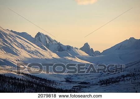 Stock Photo - Winter Scene Of The Klondike Valley With Tombstone Mountain On The Horizon, Dempster Highway, Yukon.. Fotosearch