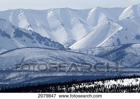 Winter Scene Of The Ogilvie Mountains Along The Dempster Highway, Yukon. View Large Photo Image Stock Photo - Winter Scene Of The Ogilvie Mountains Along The Dempster Highway, Yukon.. Fotosearch