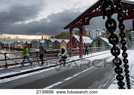 Stock Photograph - Winter snow on the old town bridge over the river Nidelva; Trondheim, Norway. Fotosearch