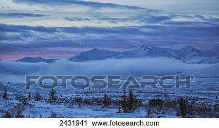 Stock Image - Winter sunrise along the Dempster Highway; Yukon, Canada. Fotosearch