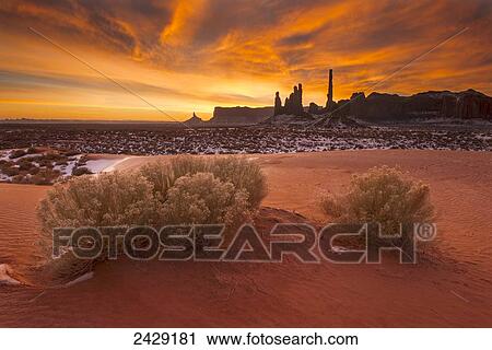 Winter sunrise over totem formation in Monument Valley Navajo Tribal Park; Arizona, United States of America View Large Photo Image Stock Image - Winter sunrise over totem formation in Monument Valley Navajo Tribal Park; Arizona, United States of America. Fotosearch