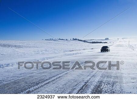 Wintry road through farmland; Tiger Hills, Manitoba, Canada View Large Photo Image Stock Photo - Wintry road through farmland; Tiger Hills, Manitoba, Canada. Fotosearch