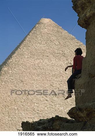 Stock Photography - Woman Admiring Great Pyramid Of Cheops. Fotosearch