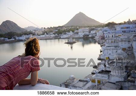 Stock Photo - Woman Admiring View Of Pushkar. Fotosearch