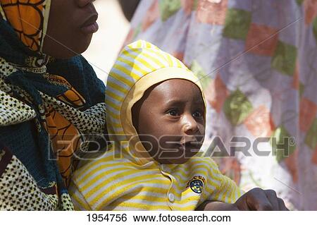 Woman and baby, Monday Market, Djenne, Mali View Large Photo Image Stock Photograph - Woman and baby, Monday Market, Djenne, Mali. Fotosearch