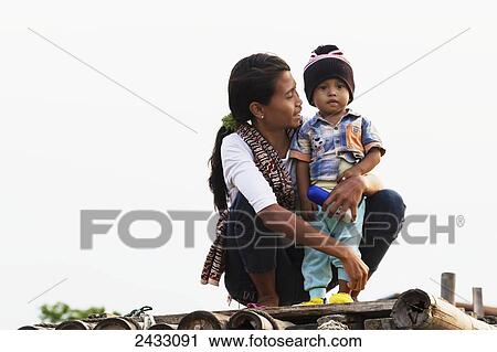 Woman and boy by Sunda Kelapa Harbour, Jakarta, Java, Indonesia View Large Photo Image Stock Image - Woman and boy by Sunda Kelapa Harbour, Jakarta, Java, Indonesia. Fotosearch
