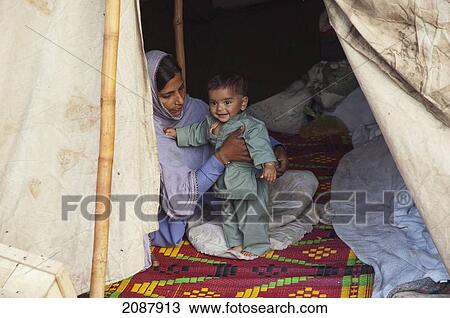 Woman And Boy In A Relief Camp Tent After The 8 October 2005 Earthquake, Muzaffarabad, Azad Kashmir, Pakistan View Large Photo Image Stock Image - Woman And Boy In A Relief Camp Tent After The 8 October 2005 Earthquake, Muzaffarabad, Azad Kashmir, Pakistan. Fotosearch