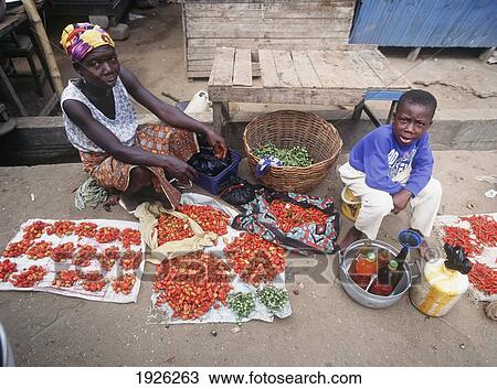 Stock Image - Woman And Child With Produce. Fotosearch