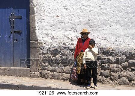 Stock Photograph - Woman And Girl Standing On The Street. Fotosearch