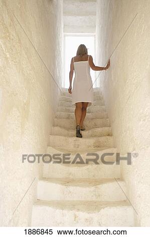 Woman Ascending Whitewashed Stairs View Large Photo Image Stock Photography - Woman Ascending Whitewashed Stairs. Fotosearch
