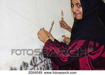 Stock Photo - Woman At A Loom In A Carpet Factory, Saqqara, Al Jizah, Egypt. Fotosearch