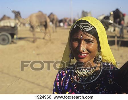 Stock Photograph - Woman At Annual Camel Festival. Fotosearch