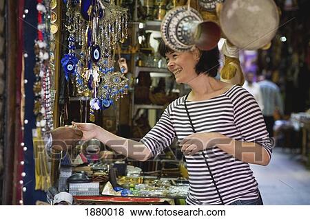 Stock Photo - Woman At Market Stall. Fotosearch