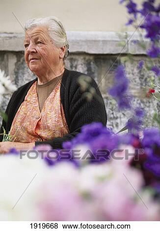 Stock Photo - Woman At Market. Fotosearch