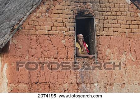 Woman At The Window Of A House Along The Road Between Ambositra & Ambavalao, Fianarantsoa Province, Madagascar View Large Photo Image Stock Photography - Woman At The Window Of A House Along The Road Between Ambositra & Ambavalao, Fianarantsoa Province, Madagascar. Fotosearch