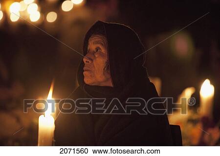 Stock Image - Woman By A Grave During The Celebration Of D. Fotosearch