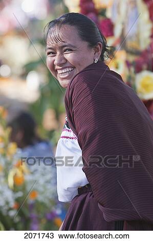 Stock Image - Woman By A Grave During The Celebration Of D. Fotosearch