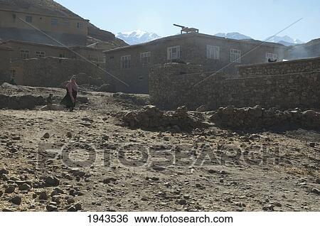 Woman By Stone Houses In Baghe Afghan, Parwan Province, Afghanistan View Large Photo Image Stock Photograph - Woman By Stone Houses In Baghe Afghan, Parwan Province, Afghanistan. Fotosearch
