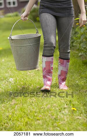 Woman Carries Metal Pail On Farm. Langley Bc View Large Photo Image Stock Image - Woman Carries Metal Pail On Farm. Langley Bc. Fotosearch
