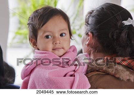 Woman Carrying A Girl, Quito, Pichincha, Ecuador View Large Photo Image Stock Photography - Woman Carrying A Girl, Quito, Pichincha, Ecuador. Fotosearch