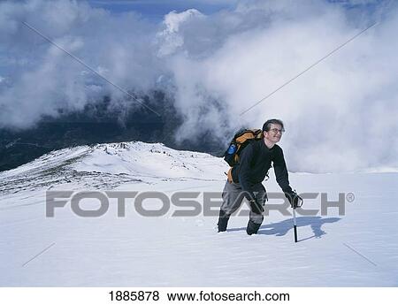 Woman Climbing Up Snowy Slope In The Sierra Nevada Mountains View Large Photo Image Stock Photo - Woman Climbing Up Snowy Slope In The Sierra Nevada Mountains. Fotosearch