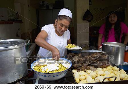 Woman Cooking In A Food Stall At The Mercado Central Market, Tarija, Bolivia View Large Photo Image Stock Photo - Woman Cooking In A Food Stall At The Mercado Central Market, Tarija, Bolivia. Fotosearch