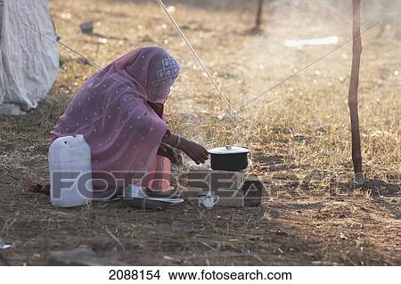 Woman Cooking In A Relief Camp After The 8 October 2005 Earthquake, Bagh, Azad Kashmir, Pakistan View Large Photo Image Picture - Woman Cooking In A Relief Camp After The 8 October 2005 Earthquake, Bagh, Azad Kashmir, Pakistan. Fotosearch