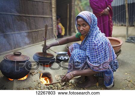 Woman cooking; Kishoreganj, Bangladesh View Large Photo Image Stock Image - Woman cooking; Kishoreganj, Bangladesh. Fotosearch