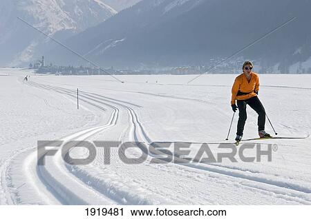 Woman Cross Country Skiing, Obergesteln, Goms Valley, Switzerland View Large Photo Image Stock Image - Woman Cross Country Skiing, Obergesteln, Goms Valley, Switzerland. Fotosearch
