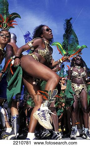 Stock Image - Woman Dancing At Carnival, Port O' Spain, Trinidad. Fotosearch
