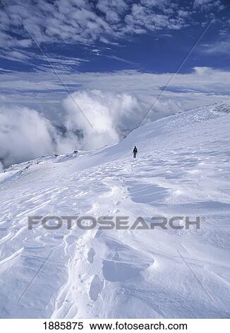 Woman Descending Snowy Slope In The Sierra Nevada Mountains View Large Photo Image Stock Photography - Woman Descending Snowy Slope In The Sierra Nevada Mountains. Fotosearch