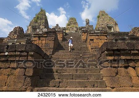 Woman descending steep steps at East Mebon Temple, built by Rajendravarman in the 10th Century; Cambodia View Large Photo Image Stock Photography - Woman descending steep steps at East Mebon Temple, built by Rajendravarman in the 10th Century; Cambodia. Fotosearch