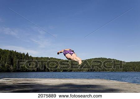 Woman Diving Into A Lake In Algonquin Park; Ontario Canada View Large Photo Image Stock Photo - Woman Diving Into A Lake In Algonquin Park; Ontario Canada. Fotosearch