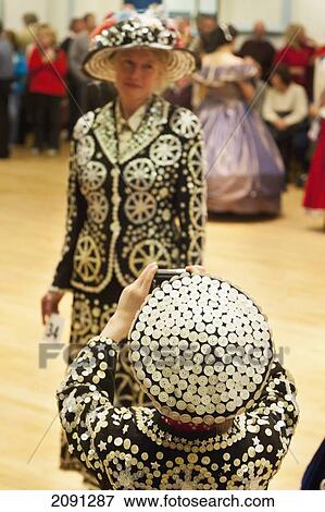 Stock Photo - Woman Dressed As Pearly Queen Being Photographed By Similarly Dressed Boy In The Annual Costume Competition Run By The Bonfire Council (Bonco) In Lewes, East Sussex, Uk. Fotosearch