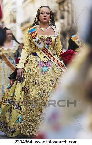Woman Dressed Up In Traditional Casal Faller Dress In Procession With Flower Offering For Virgin De Los Desamparados At Fallas Festival; Valencia, Spain View Large Photo Image Picture - Woman Dressed Up In Traditional Casal Faller Dress In Procession With Flower Offering For Virgin De Los Desamparados At Fallas Festival; Valencia, Spain. Fotosearch