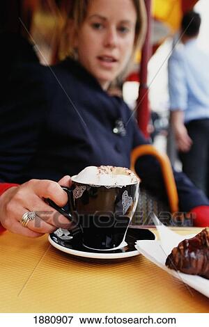Woman Drinking Capuccino In A Cafe View Large Photo Image Stock Photo - Woman Drinking Capuccino In A Cafe. Fotosearch