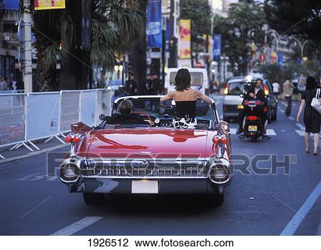 Stock Image - Woman Driving In Vintage Car. Fotosearch