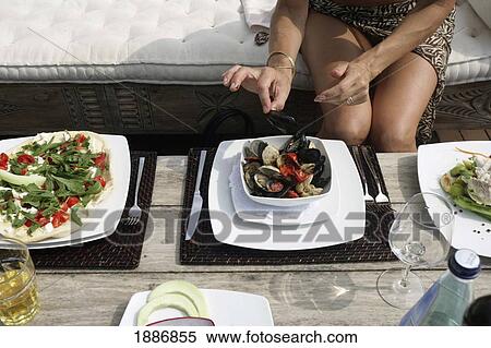 Woman Eating Mussels, Close Up View Large Photo Image Stock Photography - Woman Eating Mussels, Close Up. Fotosearch
