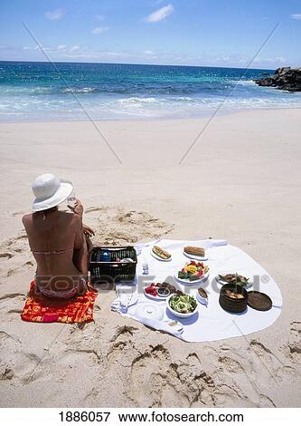 Woman Enjoying A Picnic On The Beach View Large Photo Image Stock Photo - Woman Enjoying A Picnic On The Beach. Fotosearch
