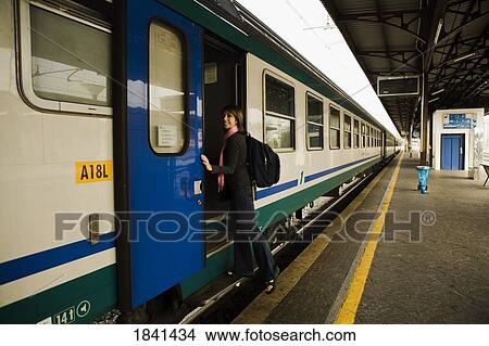 Woman Entering Train; Verona, Italy View Large Photo Image Picture - Woman Entering Train; Verona, Italy. Fotosearch