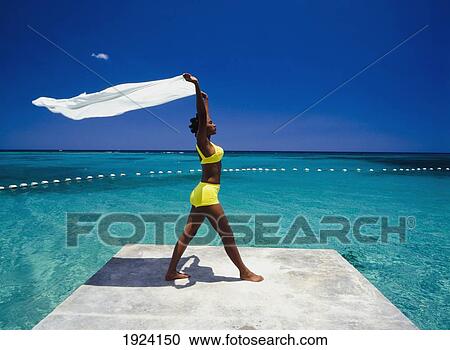 Woman Exercising Next To Ocean View Large Photo Image Stock Image - Woman Exercising Next To Ocean. Fotosearch