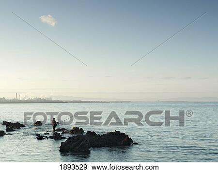 Woman Fishing Off Coast Of Elba View Large Photo Image Stock Photo - Woman Fishing Off Coast Of Elba. Fotosearch